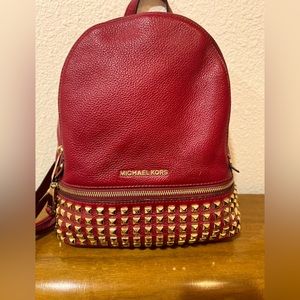 Authentic Michael Kors Burgundy back pack with gold details